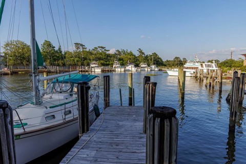 Sailboat and fishing boats in the private marina at the Grand Hotel in Point Clear, Alabama