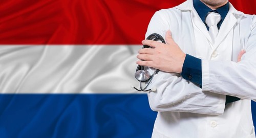 Dutch national health system, Medical professional holding sthetoscope isolated