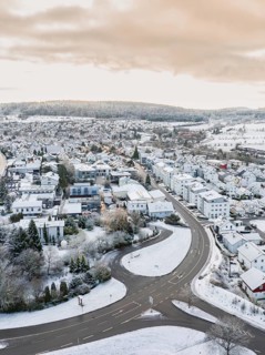 Snowy village with geometric streets and surrounding hills, Calw- Stammheim, Black Forest, Germany
