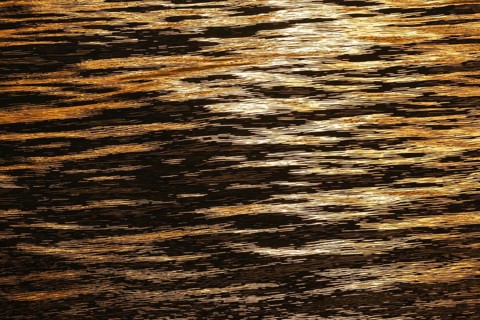 Sun rays are reflected on the sea surface, small waves, Baltic Sea