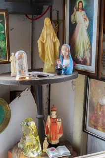 Religious statues and painting for sale inside second hand goods and chattels store, Quebec, Canada