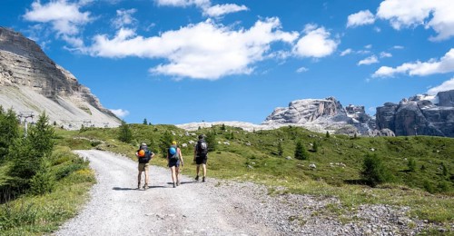 Hikers in front of Rifugio Graffer, Brenta, Brenta-Adamello Natural Park, Trentino, Italy