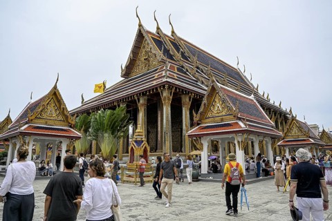 Tourists at Wat Phra Kaew, Temple of the Emerald Buddha, Bangkok, Thailand
