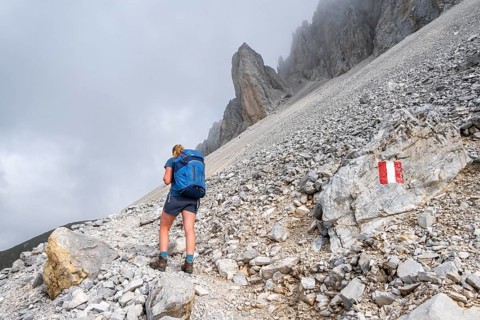 Hiker on the ascent to the Great Kinigat, Carnic Main Ridge, Carnic High Trail, Carnic Alps,
