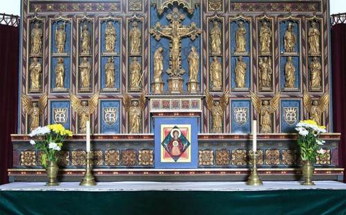 Gilt reredos of saints inside church of Saint Mary, Swilland, Suffolk, England, UK