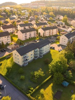 View of housing estate with apartment buildings and autumnal greenery, Calw, Black Forest, Germany