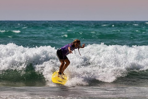 Surf rider, surfer on a wave at the beach, surf school, back light, surf spot Biarritz, Basque