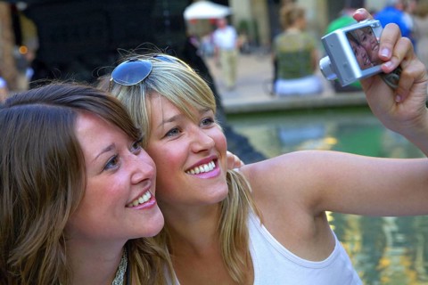 Two woman taking a selfie with the camera, Barcelona, Spain