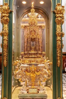 Magnificent golden reliquary behind glass, richly decorated and detailed, Cordoba