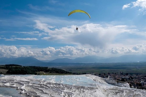 Sintered limestone terraces of Pamukkale, tandem paragliding, Pamukkale, Denizli province, Aegean