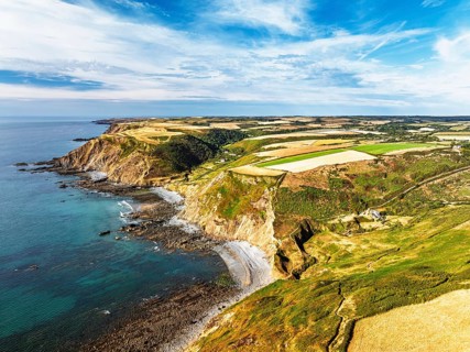 Cliffs and Fields over Welcombe Mouth Beach from a drone, North Devon and Cornwall Coastpath