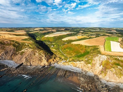 Cliffs and Fields over Welcombe Mouth Beach from a drone, North Devon and Cornwall Coastpath
