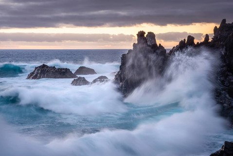 Waves break on the lava coast. In the evening. long exposure. Charco Verde, La Palma, Canary