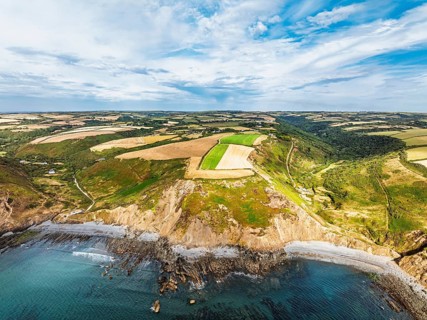 Cliffs and Fields over Welcombe Mouth Beach from a drone, North Devon and Cornwall Coastpath