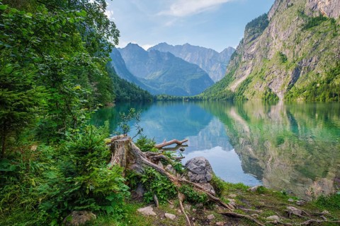 Obersee mountain lake Alps Bavaria Germany with forest shore, turquoise water, rugged peaks, and a