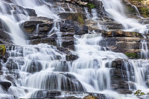 Mae Ya waterfall with cascading flowing water, near Doi Inthanon National Park, Chiang Mai