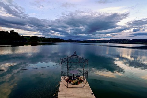 Table with two chairs on a pier at Lac d'Aiguebelette, Great Natural Lake, Aiguebelette-le-Lac,