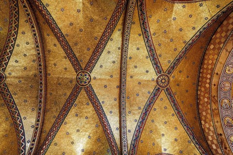 Gilded mosaic vaulting illuminate the apse of the Grade II listed Fitzrovia Chapel, London,