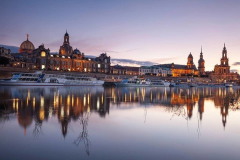 14 October 2021, Evening view of the historic skyline illuminated along the Elbe River in Dresden,
