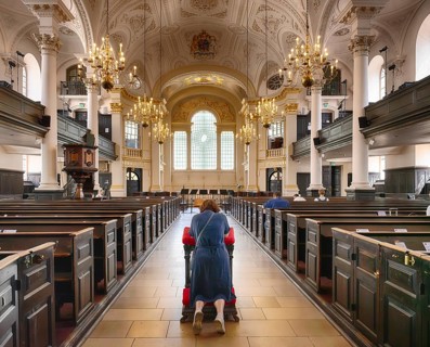 Interior view of people praying in St Martin-in-the-Fields Church, City of Westminster, London,