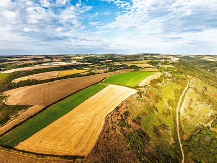 Cliffs and Farms over North Devon and Cornwall Coastpath Border from a drone, Welcombe Mouth Beach,