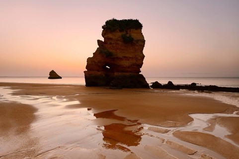 Rock formation on the beach at sunrise, Praia Dona Ana, Lagos, Algarve, Portugal