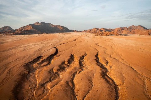 Aerial view, evening mood, canyons in the Namib Desert behind Naukluft Mountains, Namib Naukluft