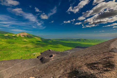 Beautiful view of the volcano, surrounded by vegetation, from Cerro Negro, Nicaragua