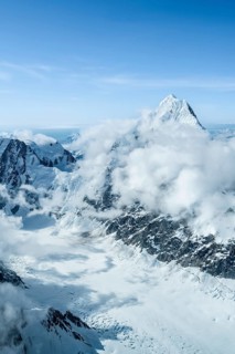 Summit of high mountains with glaciers, Mount Huntington on the right, 3731 m, aerial view, Alaska