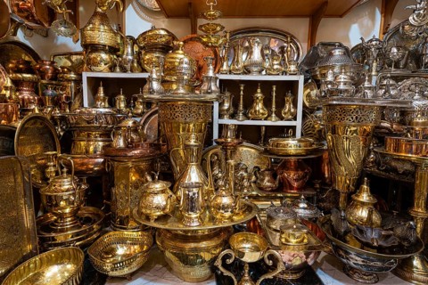 Brass and copper vessels on display for sale in a shop, Souk, Bazaar, Maghreb, Marrakech, Morocco,