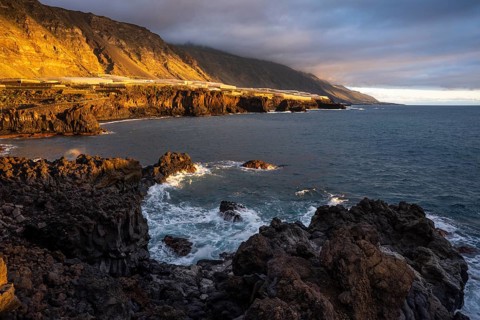 Sea, lava rocks and coast at Playa Charco Verde at the golden hour. La Palma, Canary Islands, Spain