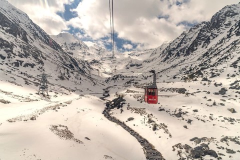 Cable car in the snowy Balea Valley to Lake Balea, Fagaras Mountains, South Carpathians,