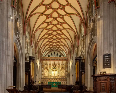 Fan-vaulted ceiling view to altar reredos, Church of Saint Mary, Ottery St Mary, Devon, England, UK