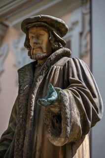 Detail, green, naturally colored patina of the hand of the bronze statue of humanist Melanchton,
