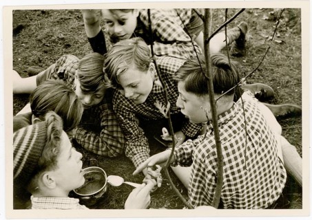 Outdoor picnic, rascal, excursion, hiking trip, group of boys sitting together outdoors, engaged in