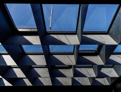 Geometric grid arrangement of skylight windows with deep metal or concrete reveals, Berlin, Germany