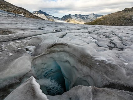 Glacier mill, glaciated mountains behind, Venedigerkees, Venice Group, Hohe Tauern National Park,