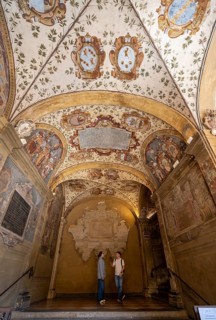 Arcades with ceiling paintings in the courtyard of the Palazzo dell'Archiginnasio, historic former