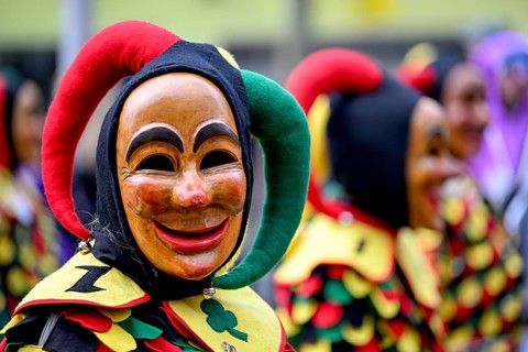 Member of a fools' guild in traditional Haes, fools' clothes, during the carnival procession in