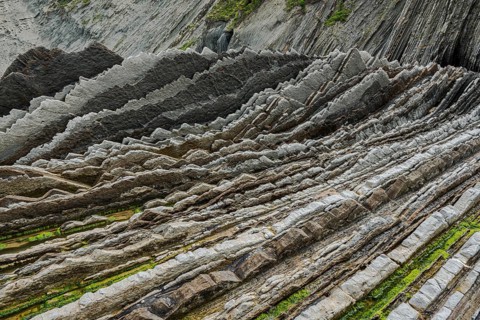 Geological formation of sandstone and limestone layers, Flysch on Itzurun Beach in Zumaia, Spain