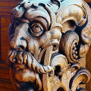 Expressive head carved entirely from oak wood on the council stalls in the Upper Town Hall in