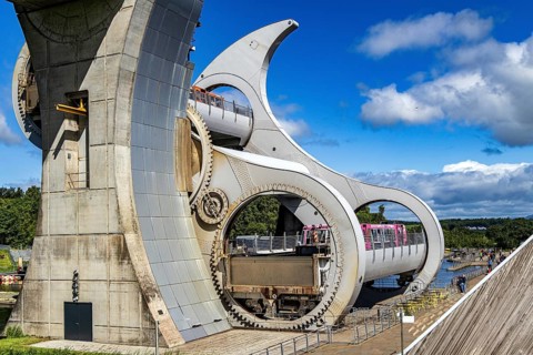 The Falkirk Wheel is the world's only rotating boat lift, connecting Scotland's Forth and Clyde