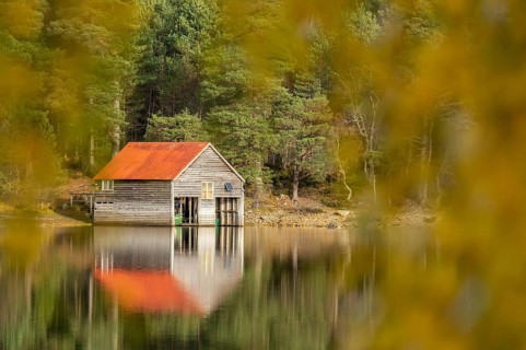 Boathouse on the shores of a lake in Scotland, Aviemore, Scotland, Great Britain