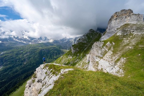 Mountaineers in front of picturesque mountain scenery at the summit of Tanzbödeli, mountain