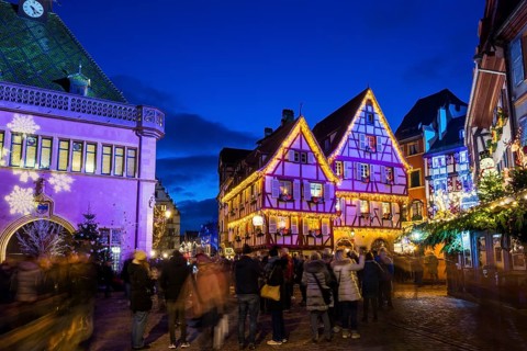 Colourfully illuminated and Christmassy decorated half-timbered houses, old town, blue hour,