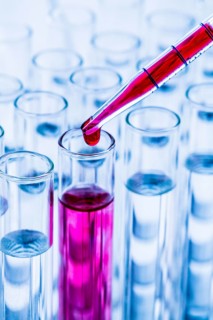 Many reagent glasses doing an experiment in a university research laboratory. Symbolic photo for