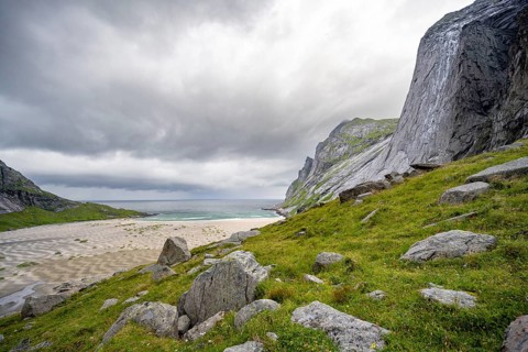 Bunesstranden sandy beach between rocky mountain peaks, Lofoten, Norway