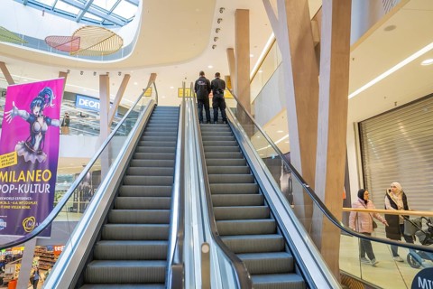 Interior view of a shopping center with escalator, surroundings and visitors, Milaneo, Stuttgart,