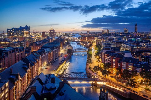 View of the Customs Canal, Speicherstadt, Elbe Philharmonic Hall and St. Michaelis at the Blue