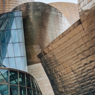 Exterior view of the Guggenheim Museum with titanium plates and glass elements in Bilbao, Spain